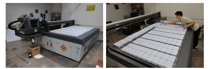 MEST Print Vision UV printer with unprocessed storage boxes awaiting printing MEST Print Vision UV printer with unprocessed storage boxes awaiting printing