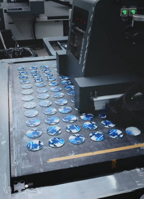 See how our Visual positioning uv printer transforms blank discs into flawless custom magnets.